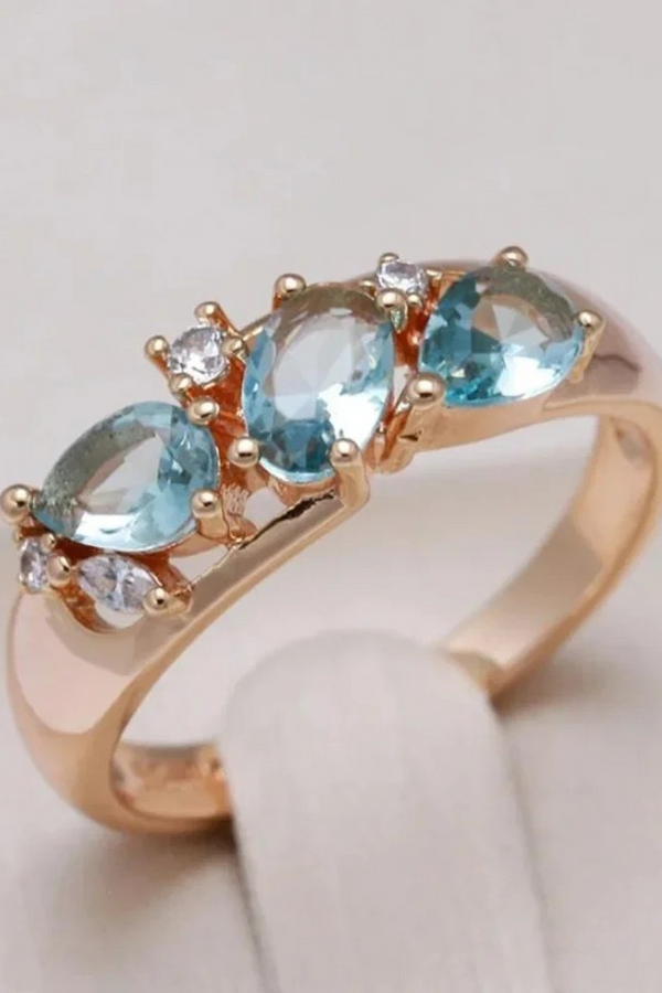 Gold ring with blue zirconia